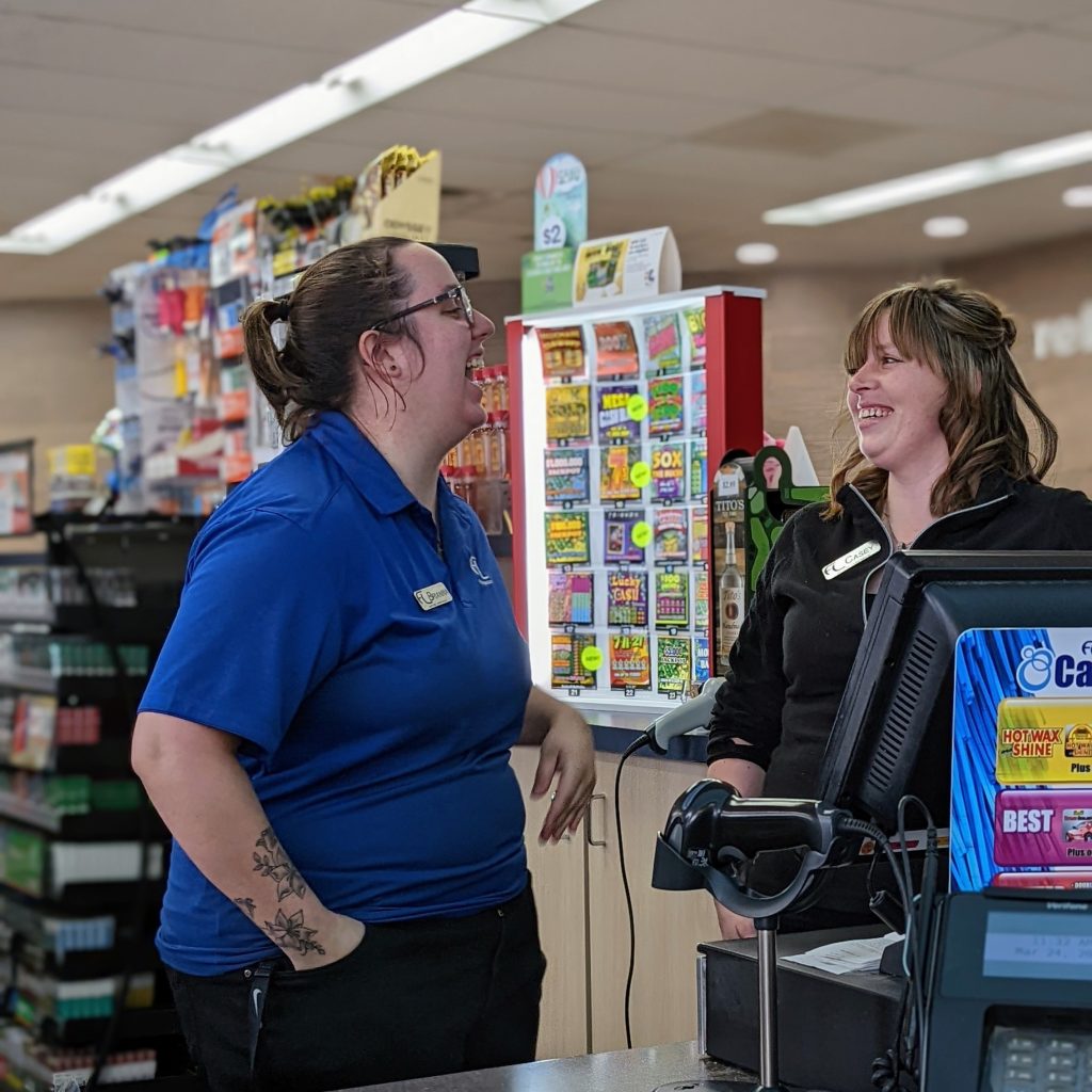 Two Employees Chatting at the Register